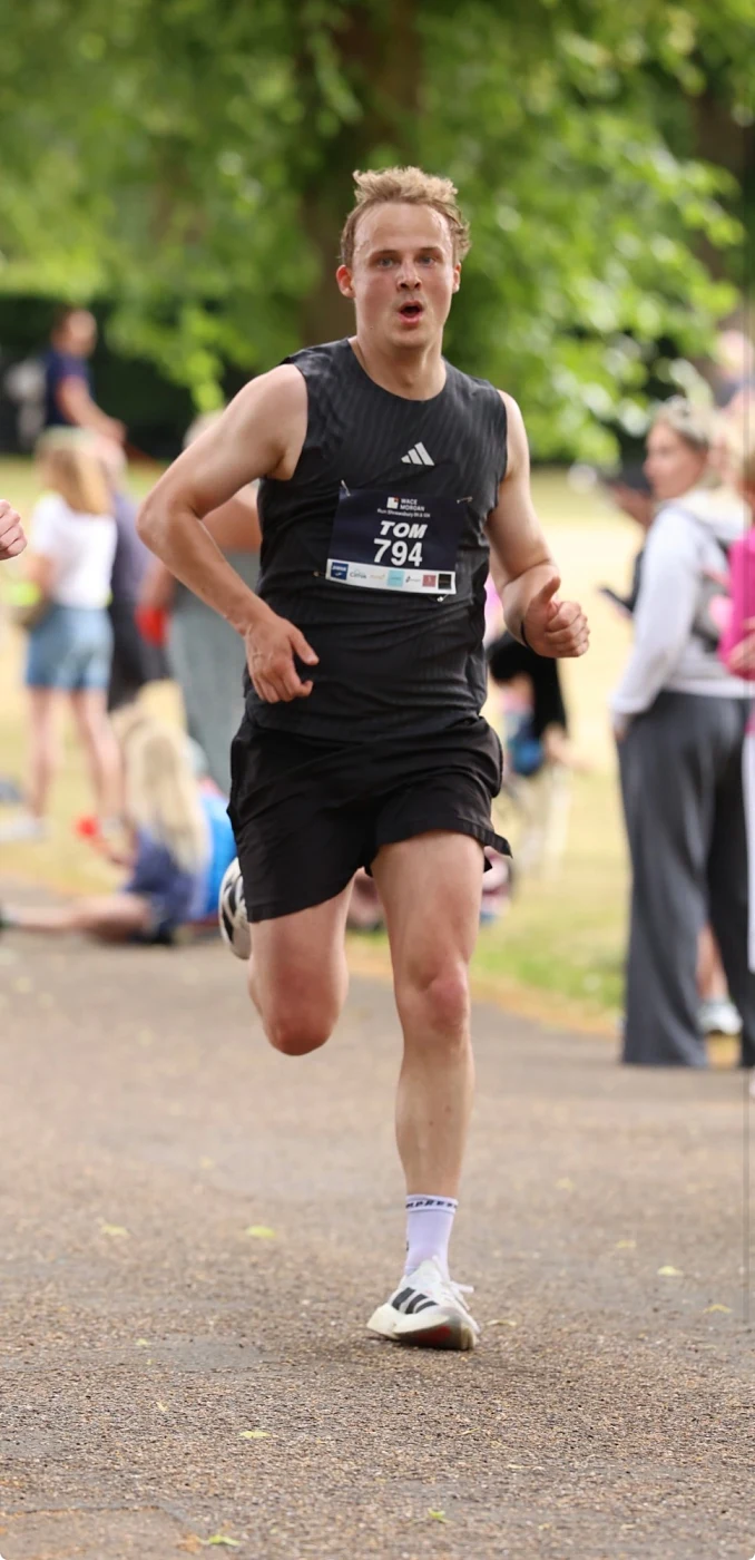 Tom racing a 10K, wearing number 794