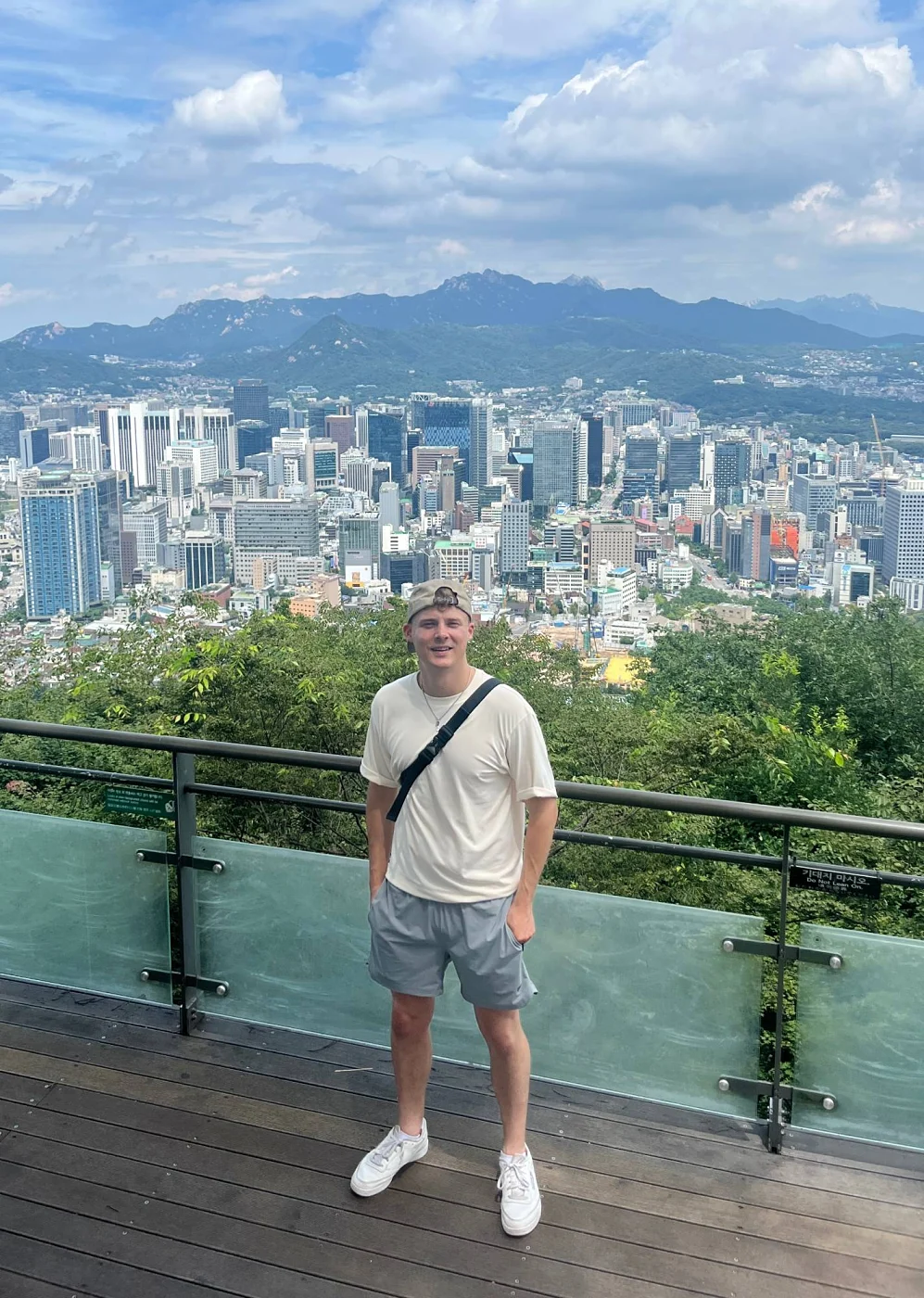 Tom at a lookout above the Seoul skyline